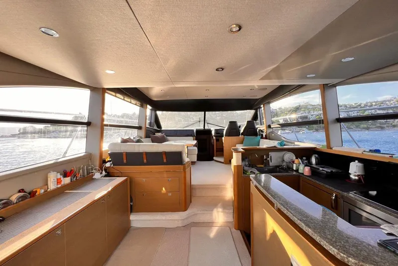  Yacht Photos Pics Luxurious interior of 2015 Princess Flybridge 52 Motor Yacht with panoramic windows.