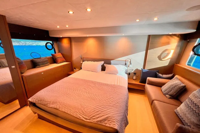  Yacht Photos Pics Luxurious bedroom interior of 2015 Princess Flybridge 52 Motor Yacht with ocean view.