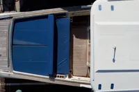 Overhead view of 2010 Rhea 35 Open boat with blue seating and wooden deck.