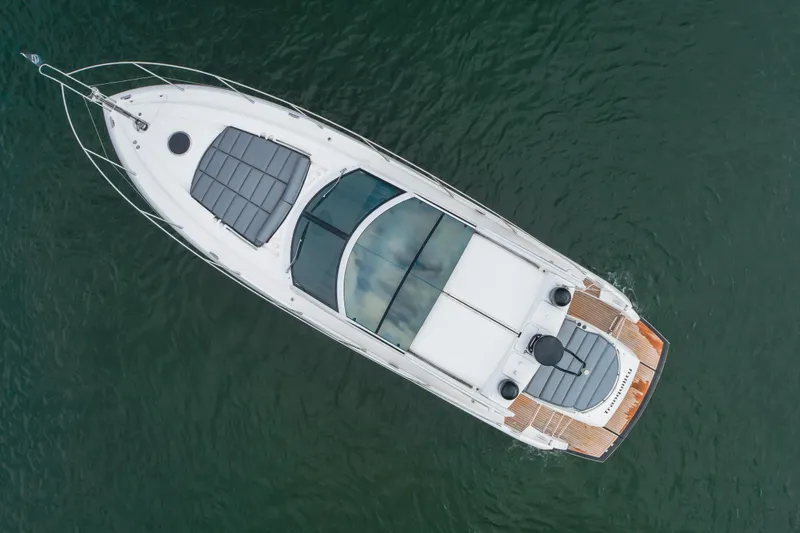 Tranquility Yacht Photos Pics Overhead view of 2012 Sunseeker Portofino 48 yacht on water.