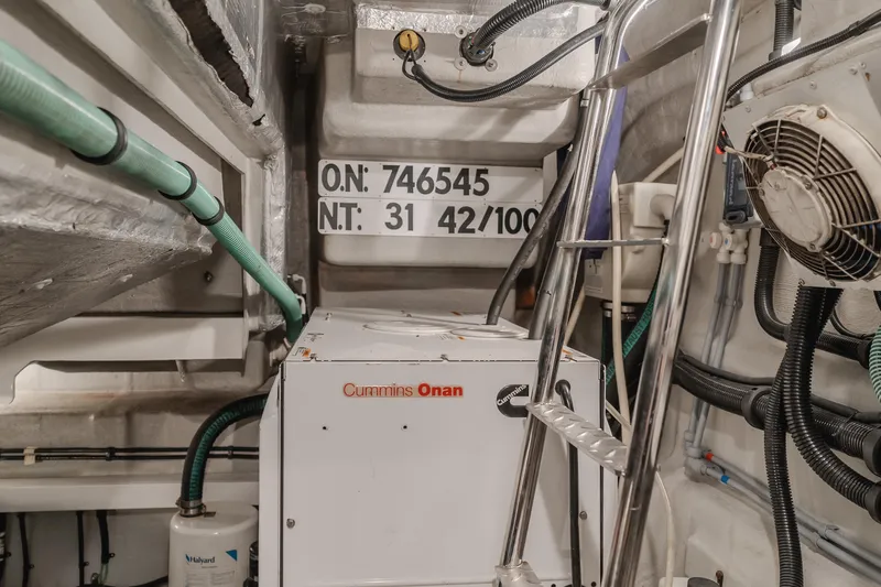 Tranquility Yacht Photos Pics Engine room of 2012 Sunseeker Portofino 48 with Cummins Onan generator and equipment.