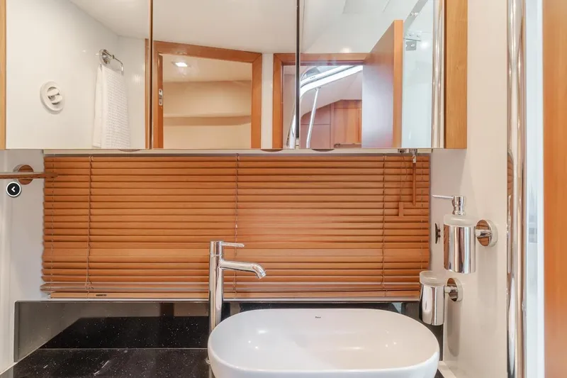 Tranquility Yacht Photos Pics Luxurious bathroom interior of 2012 Sunseeker Portofino 48 yacht with modern fixtures.