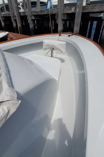 Charmer Yacht Photos Pics 1985 Rybovich 32 Express Walkaround Sportfish boat deck near dock.