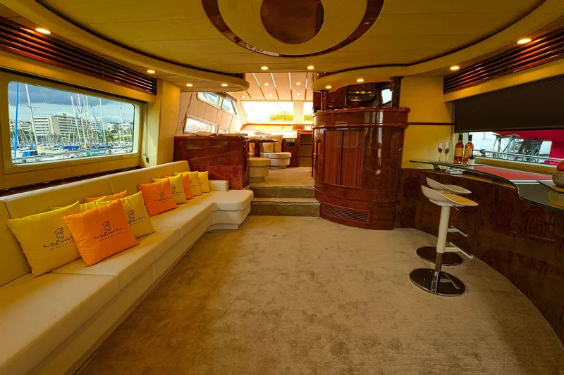 Ma Bella Yacht Photos Pics Luxurious interior of 1999 Monte Fino 72 yacht with elegant seating and bar area.