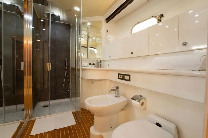Ma Bella Yacht Photos Pics Luxurious bathroom on 1999 Monte Fino 72 yacht with modern shower and elegant fixtures.