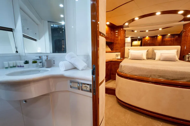 Ma Bella Yacht Photos Pics Luxurious interior of 1999 Monte Fino 72 yacht with elegant bedroom and bathroom.
