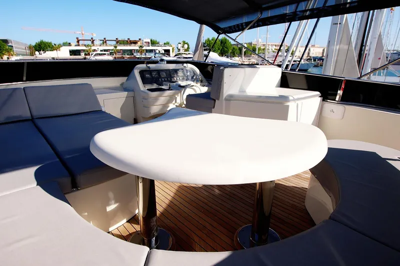 Ma Bella Yacht Photos Pics Luxurious 1999 Monte Fino 72 yacht interior with seating and helm, docked at marina.