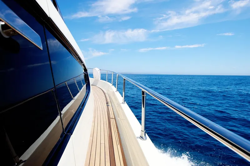 Ma Bella Yacht Photos Pics Monte Fino 72 yacht cruising on open sea, clear blue sky, 1999 model.