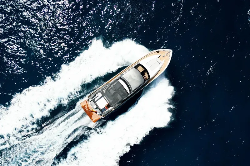 Ma Bella Yacht Photos Pics Aerial view of 1999 Monte Fino 72 yacht cruising on open sea.