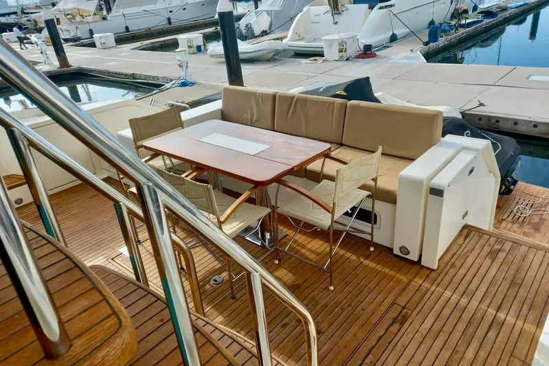 Zero One Yacht Photos Pics Luxury yacht Fairline Squadron 65, 2012 model, featuring elegant outdoor seating and dining area.