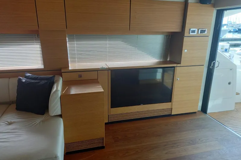 Zero One Yacht Photos Pics Interior of 2012 Fairline Squadron 65 yacht with modern wood finish and seating area.