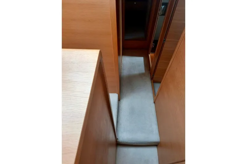 Zero One Yacht Photos Pics Interior hallway of 2012 Fairline Squadron 65 yacht with wooden paneling.