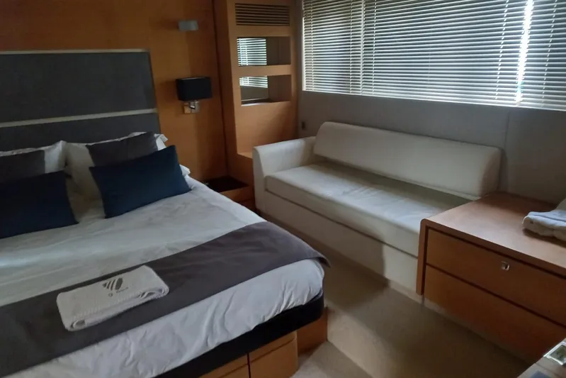 Zero One Yacht Photos Pics Luxurious cabin interior of 2012 Fairline Squadron 65 yacht with bed and sofa.