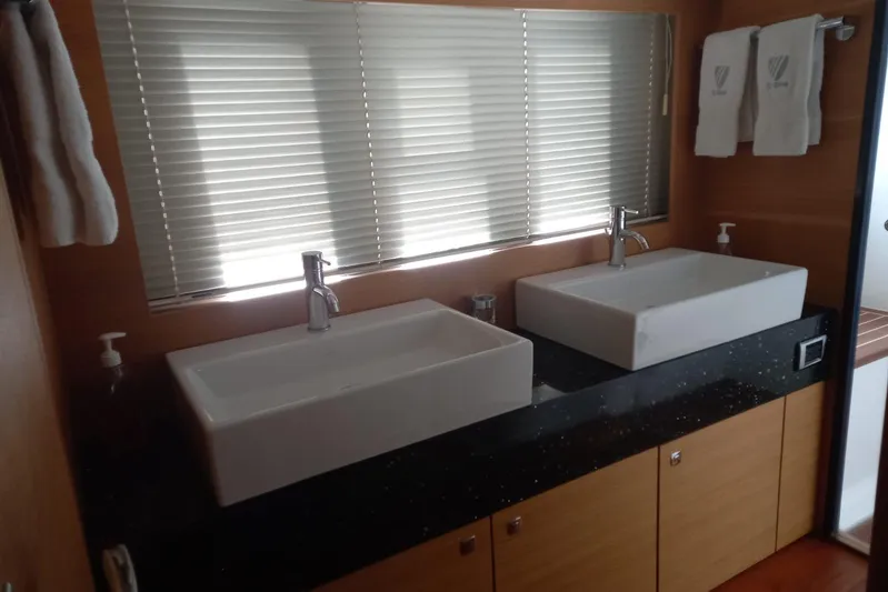 Zero One Yacht Photos Pics Luxurious bathroom with dual sinks in 2012 Fairline Squadron 65 yacht.