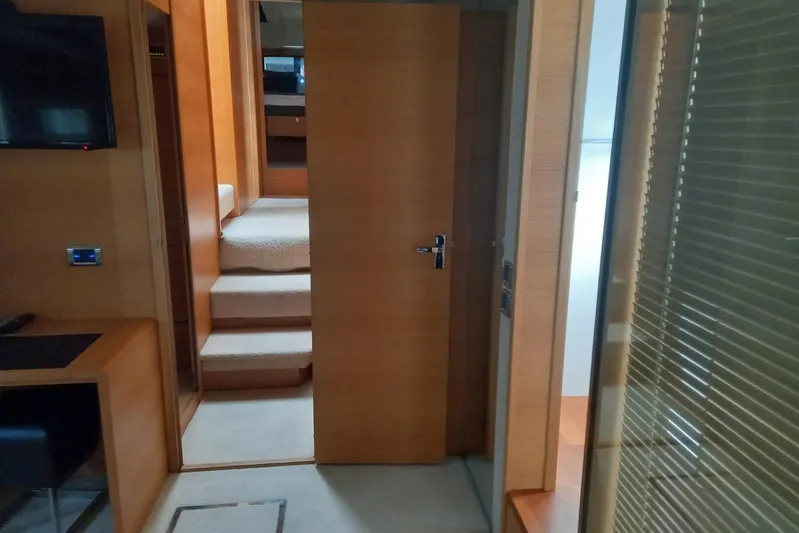 Zero One Yacht Photos Pics Interior of 2012 Fairline Squadron 65 yacht, featuring wooden stairs and modern design elements.