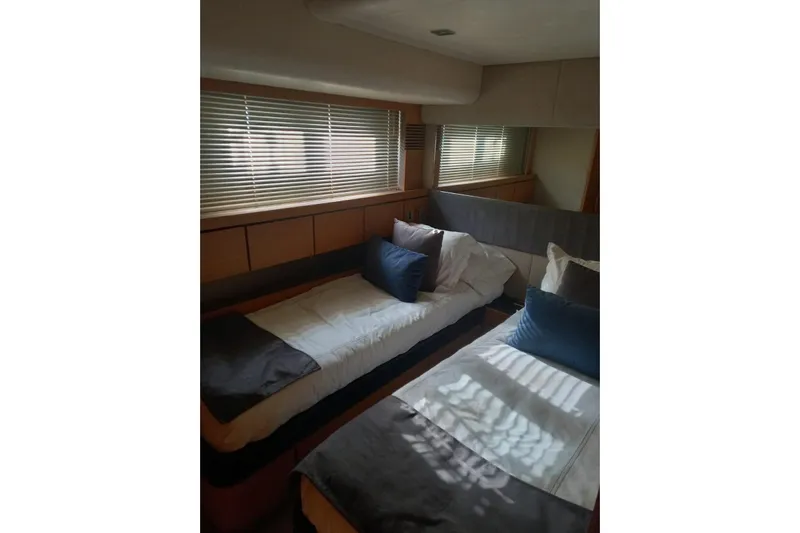 Zero One Yacht Photos Pics Interior of 2012 Fairline Squadron 65 yacht with twin beds and modern decor.