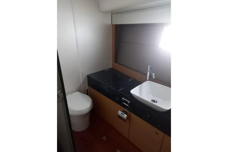 Zero One Yacht Photos Pics Luxury bathroom in 2012 Fairline Squadron 65 yacht with modern sink and toilet.