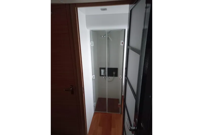 Zero One Yacht Photos Pics Shower area inside 2012 Fairline Squadron 65 yacht, featuring glass doors and modern fixtures.