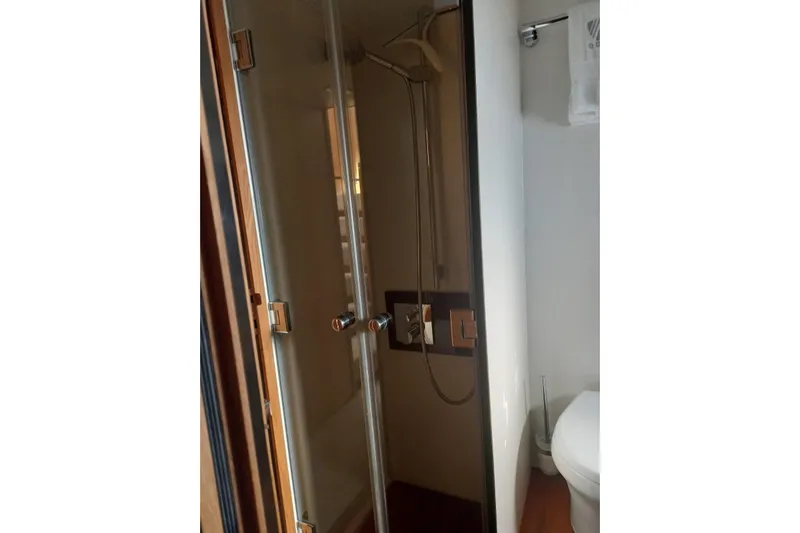 Zero One Yacht Photos Pics Bathroom interior of 2012 Fairline Squadron 65 yacht, featuring shower and toilet.