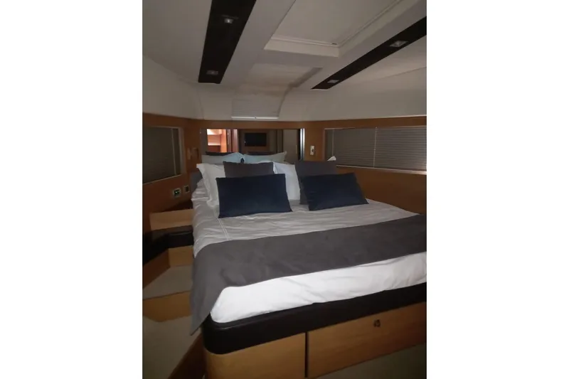 Zero One Yacht Photos Pics Luxurious bedroom interior of 2012 Fairline Squadron 65 yacht with elegant bedding.