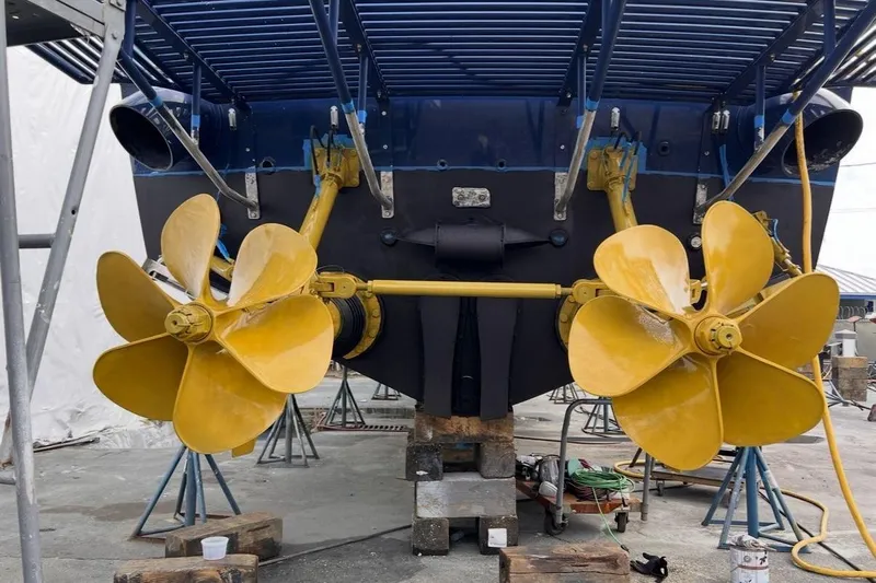Jam Yacht Photos Pics Yellow propellers of a 2013 Magnum 51 Bestia boat in dry dock.