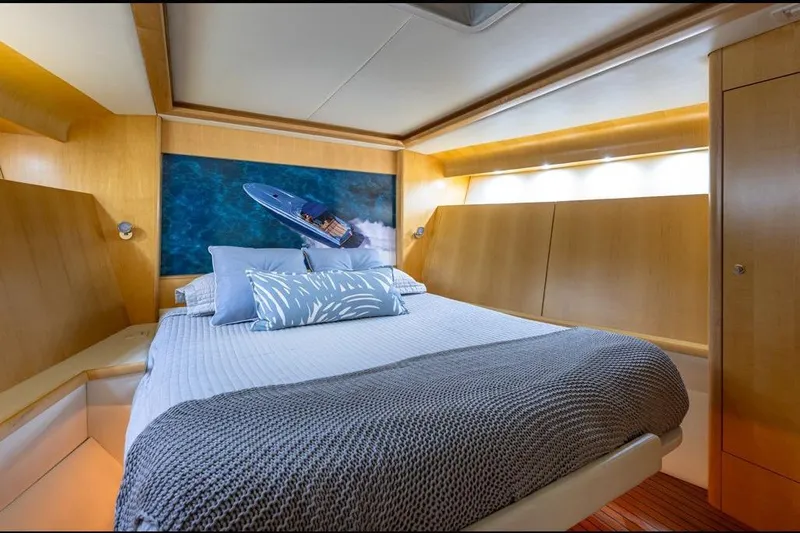 Jam Yacht Photos Pics Luxurious cabin interior of 2013 Magnum 51 Bestia yacht with cozy bedding.