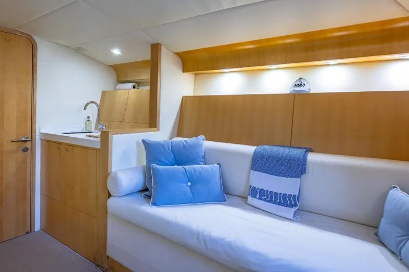 Jam Yacht Photos Pics Luxurious interior of 2013 Magnum 51 Bestia yacht with cozy seating and elegant decor.