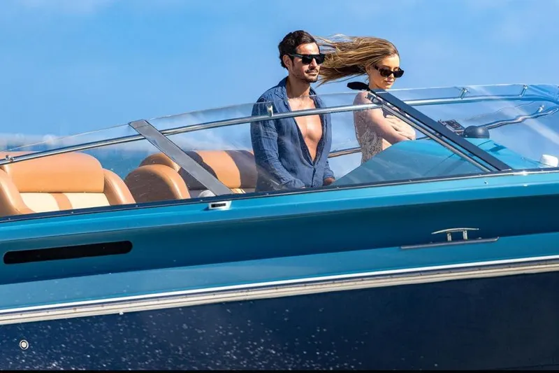 Jam Yacht Photos Pics Couple enjoying a ride on a 2013 Magnum 51 Bestia speedboat.