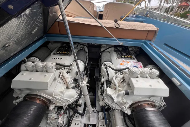 Jam Yacht Photos Pics Engine compartment of a 2013 Magnum 51 Bestia boat, showcasing dual powerful engines.