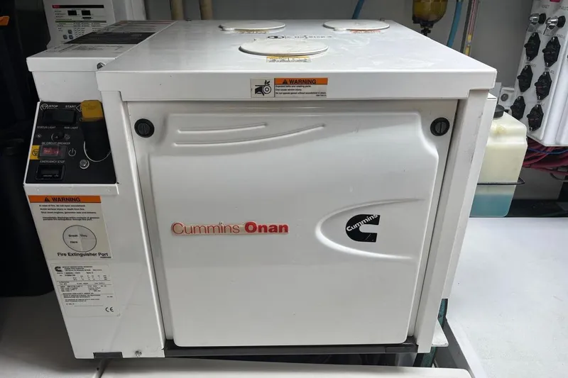 Jam Yacht Photos Pics Cummins Onan generator in a 2013 Magnum 51 Bestia yacht engine room.