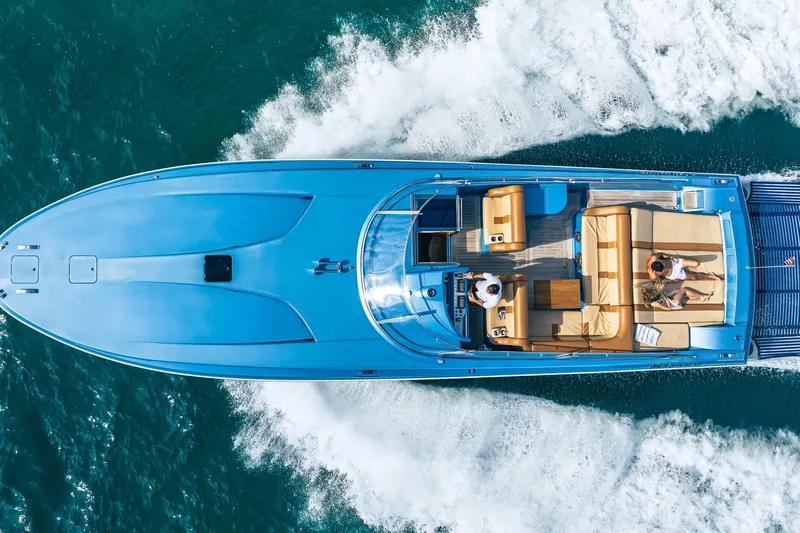 Jam Yacht Photos Pics Aerial view of 2013 MAGNUM MARINE 51 Bestia yacht cruising on the ocean.