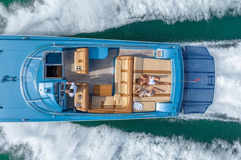 Jam Yacht Photos Pics Aerial view of 2013 MAGNUM MARINE 51 Bestia yacht cruising with passengers.