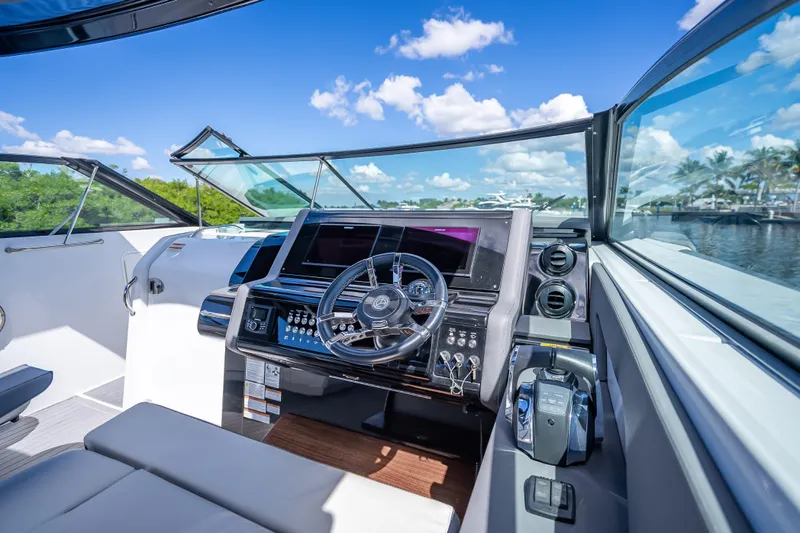  Yacht Photos Pics 2022 Cruisers Yachts 38 GLS OB helm with modern controls and panoramic view.