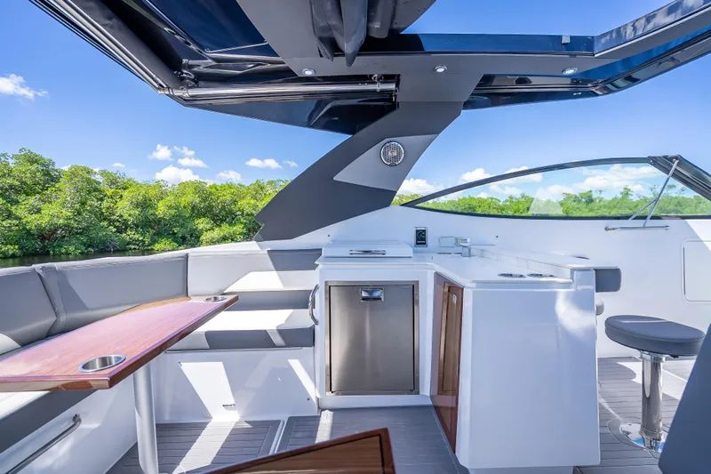  Yacht Photos Pics 2022 Cruisers Yachts 38 GLS OB interior with sleek seating and modern amenities.