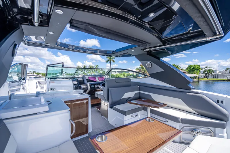  Yacht Photos Pics 2022 Cruisers Yachts 38 GLS OB interior with luxurious seating and modern amenities.