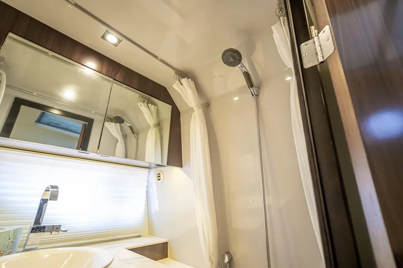  Yacht Photos Pics Luxurious bathroom interior of 2022 Cruisers Yachts 38 GLS OB with modern fixtures.