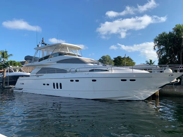  Yacht Photos Pics 2007 Fairline Squadron 68 yacht docked under a clear blue sky.