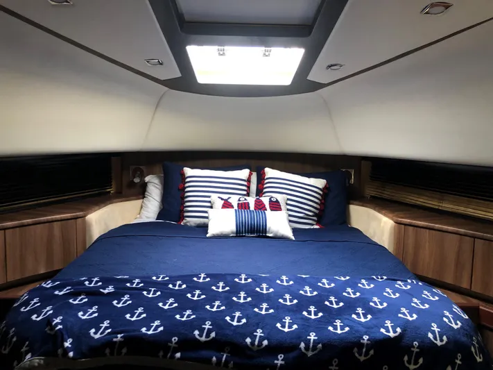  Yacht Photos Pics Luxurious cabin interior of 2007 Fairline Squadron 68 yacht with nautical-themed bedding.