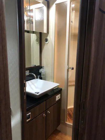  Yacht Photos Pics Bathroom interior of 2007 Fairline Squadron 68 yacht with modern sink and shower.
