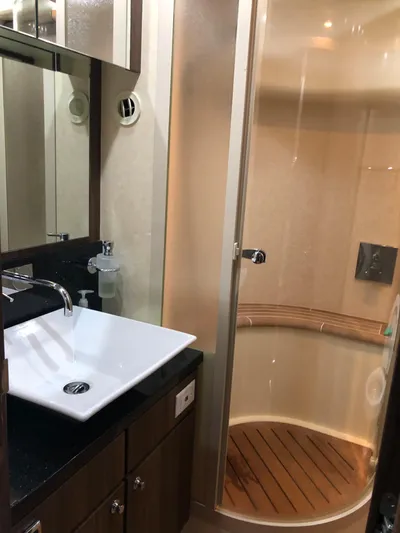  Yacht Photos Pics Luxurious bathroom in 2007 Fairline Squadron 68 yacht with modern sink and enclosed shower.