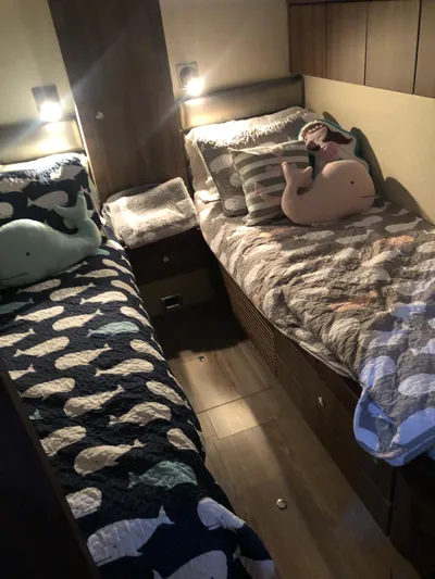  Yacht Photos Pics Cozy twin cabin beds with whale-themed decor on a 2007 Fairline Squadron 68 yacht.