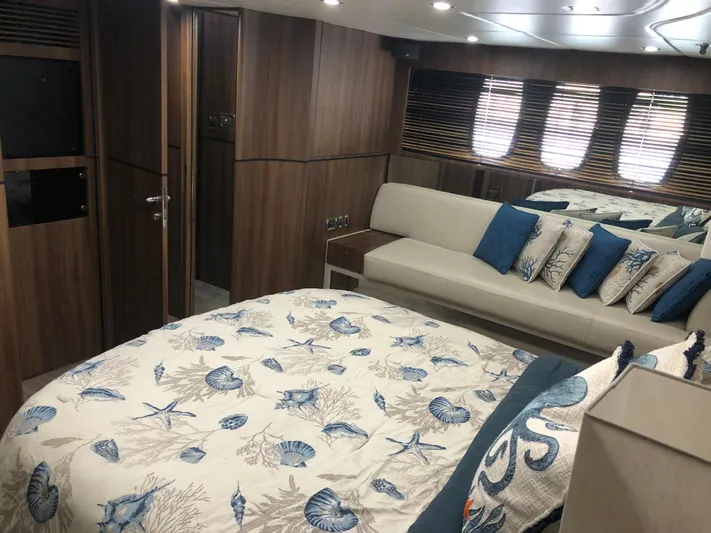  Yacht Photos Pics Luxurious cabin interior of 2007 Fairline Squadron 68 yacht with elegant bedding and seating.
