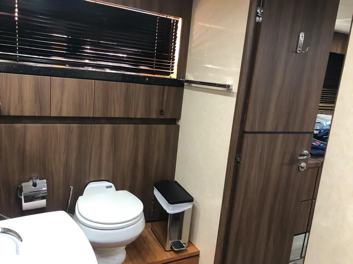  Yacht Photos Pics Luxurious bathroom interior of 2007 Fairline Squadron 68 yacht with wood accents.