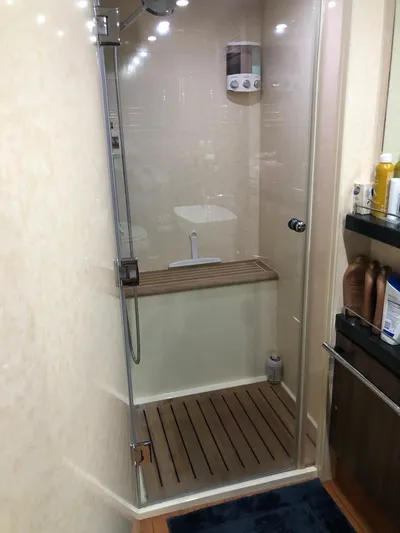  Yacht Photos Pics Shower area in 2007 Fairline Squadron 68 yacht with glass door and wooden floor.