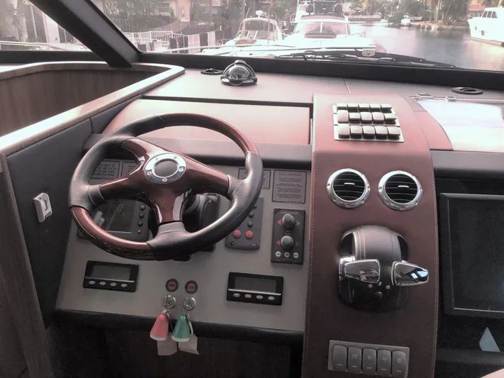  Yacht Photos Pics Cockpit of 2007 Fairline Squadron 68 yacht with steering wheel and control panel.