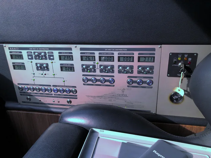  Yacht Photos Pics Control panel of a 2007 Fairline Squadron 68 yacht, featuring various switches and displays.
