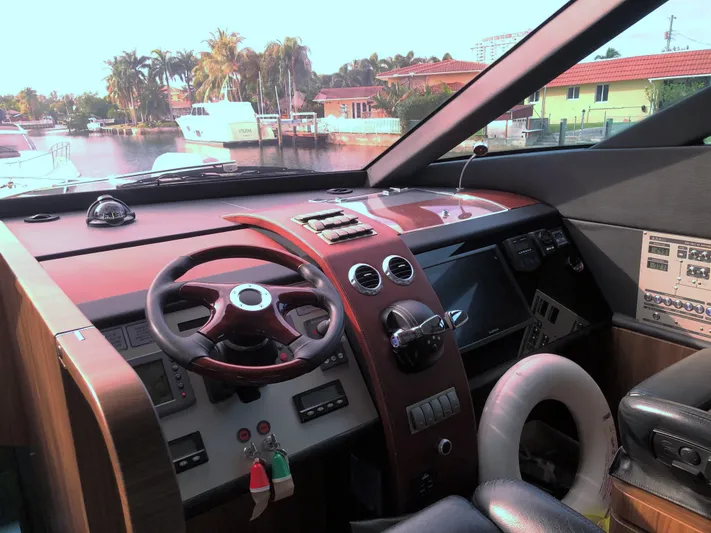  Yacht Photos Pics Interior cockpit of 2007 Fairline Squadron 68 yacht with steering wheel and control panels.