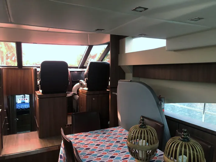  Yacht Photos Pics Interior of 2007 Fairline Squadron 68 yacht with dining area and helm station.