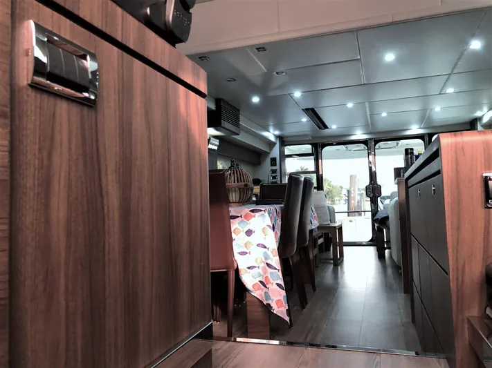  Yacht Photos Pics Luxurious interior of 2007 Fairline Squadron 68 yacht with modern wood finishes and dining area.