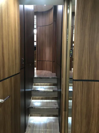  Yacht Photos Pics Interior of 2007 Fairline Squadron 68 yacht with wooden paneling and staircase.